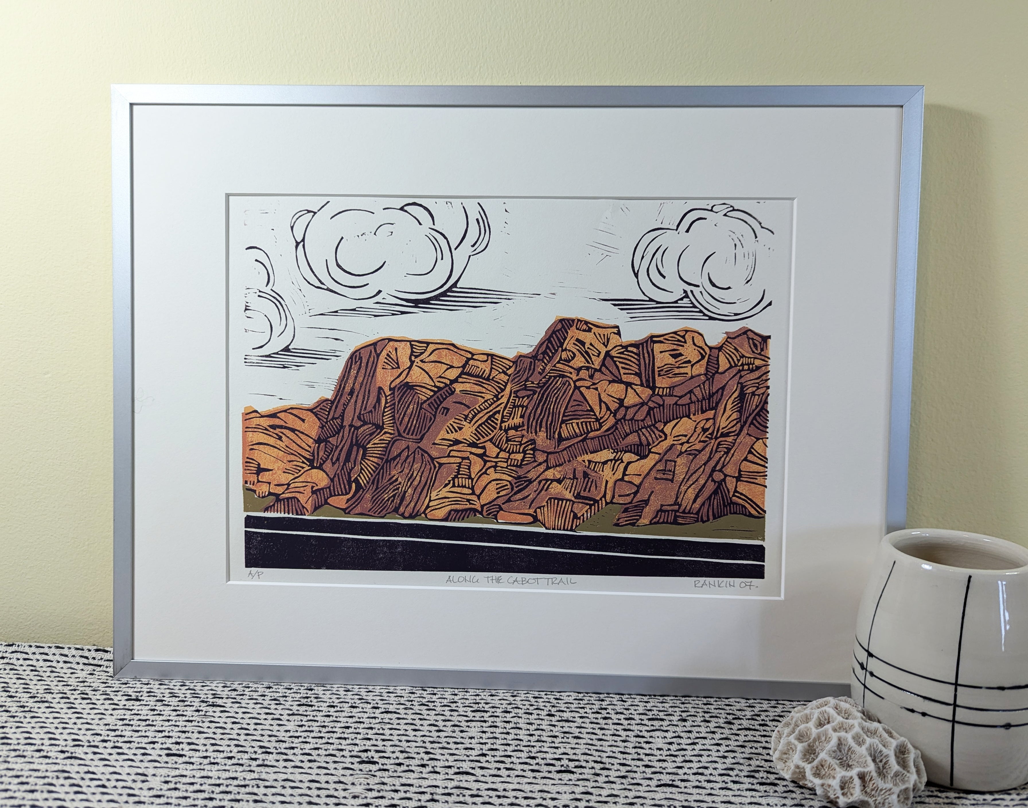 Along the Cabot Trail reduction linocut framed