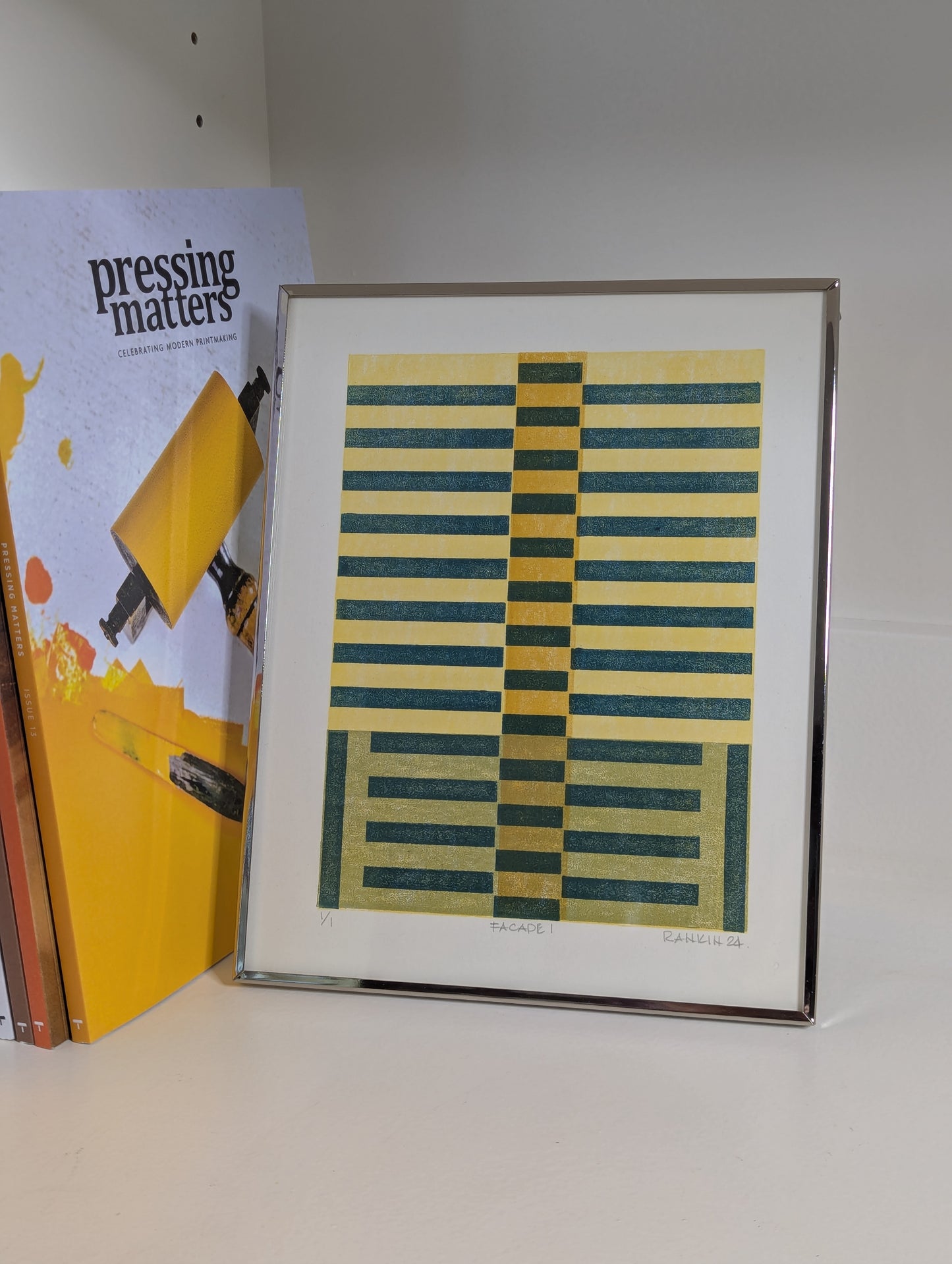 Framed abstract art print with geometric pattern 