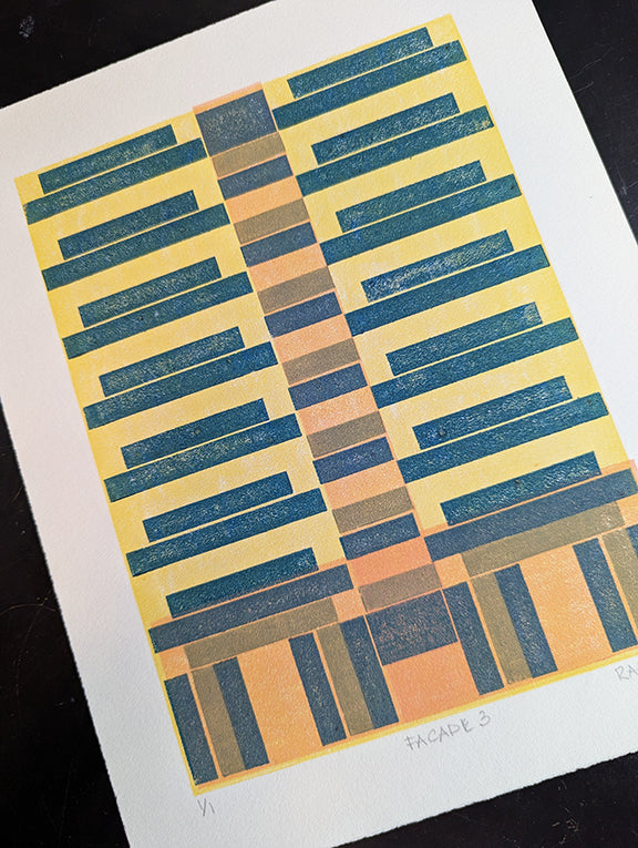 Geometric pattern print with teal and green stripes on a coral and yellow background