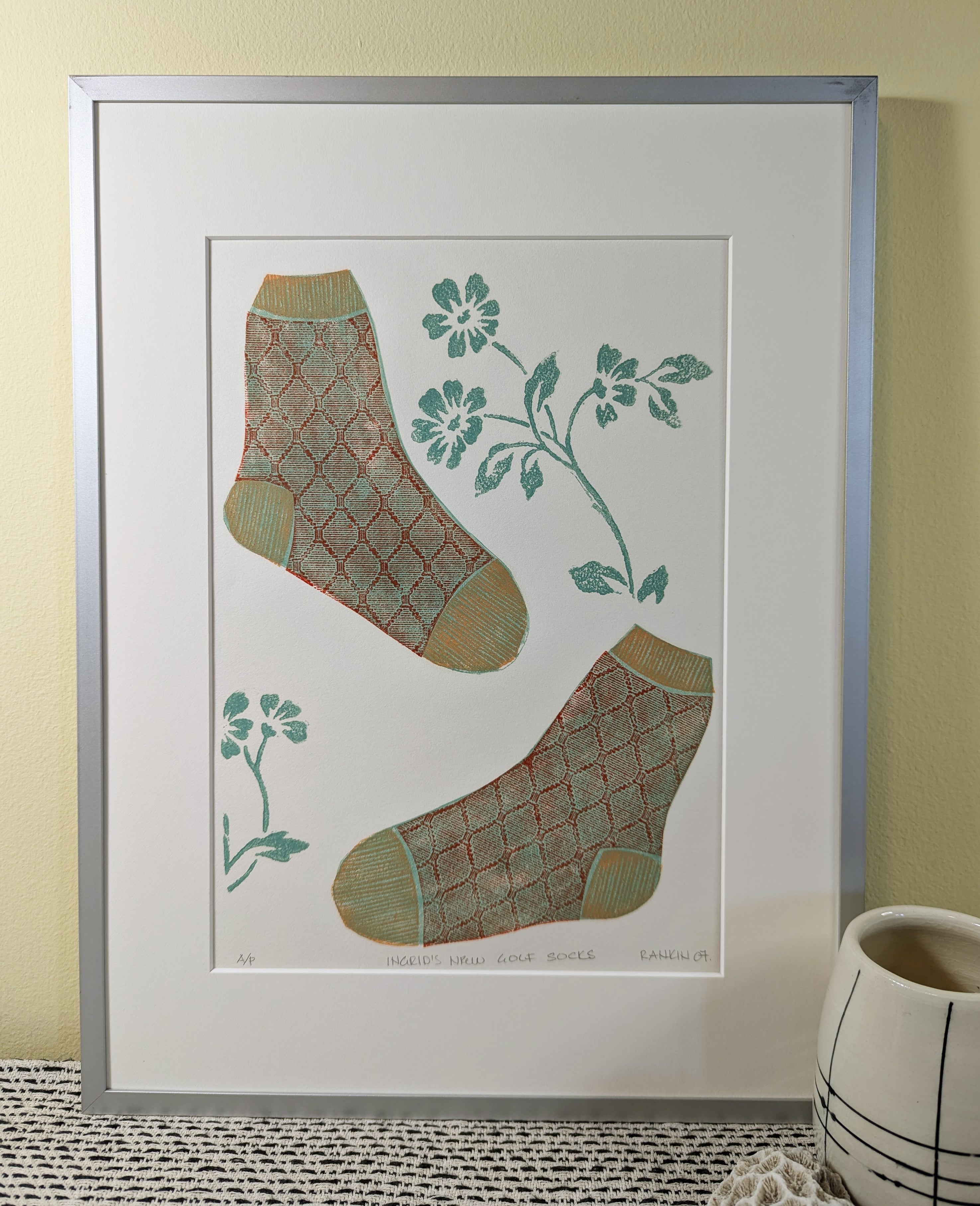 Ingrid's New Golf Socks collagraph print framed